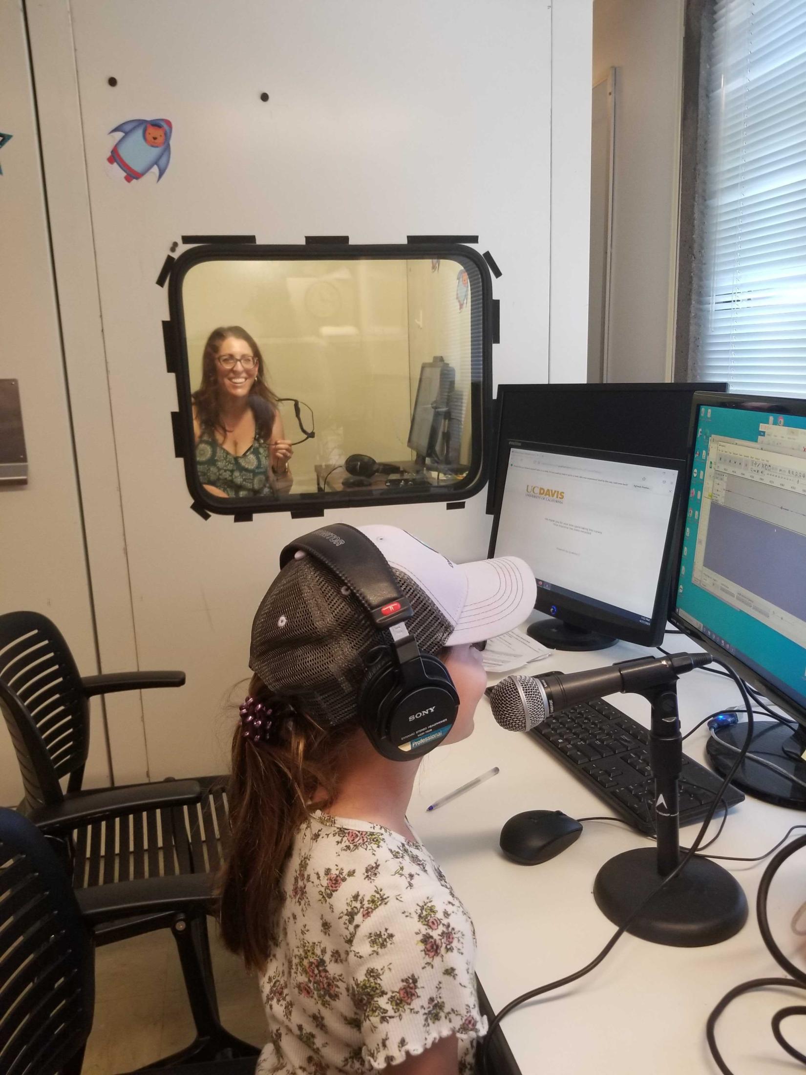 A family playing with the soundbooth